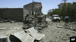 A general view shows the scene after suicide blasts near an Italian-run compound in Herat, May 30, 2011