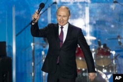 Russian President Vladimir Putin attends a concert in Sevastopol, Crimea, March 14, 2018.