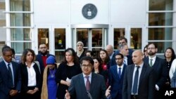 (File) Omar Jadwat, center, director of the ACLU's Immigrants' Rights Project, speaks at a news conference outside a federal courthouse in Greenbelt, Maryland, Oct. 16, 2017, following a hearing regarding three lawsuits against Trump administration. 