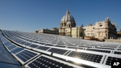 FILE - A photo shows solar panels on the roof of the Paul VI Hall, at the Vatican.