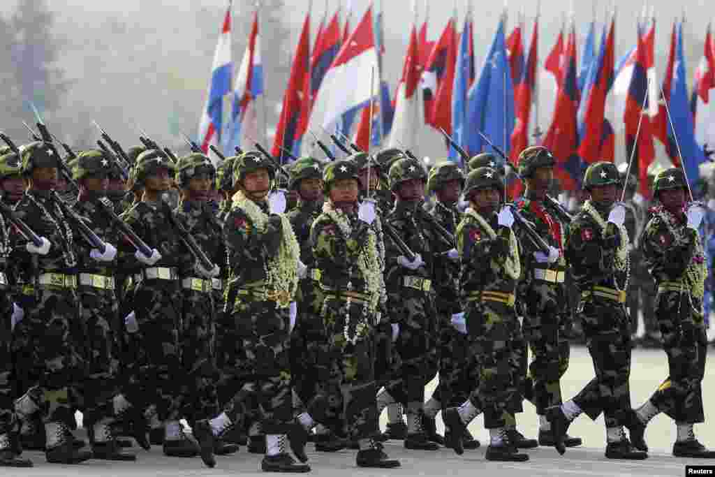 An honor guard marches during a parade to mark the 68th anniversary of Armed Forces Day in Burma's capital Naypyitaw, March 27, 2013. 