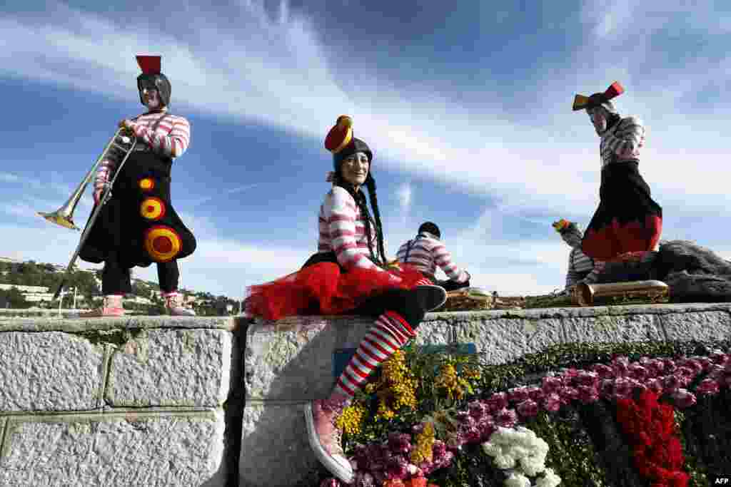Revelers attend the traditional &quot;battle of flowers&quot; carnival event in Villefranche-sur-Mer, southeastern France.