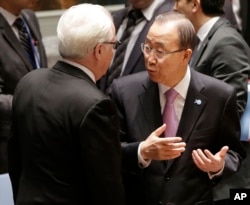 U.N. Secretary-General Ban Ki-moon, right, talks with Vitaly Churkin, Russia's U.N. ambassador, before a Security Council meeting at U.N. headquarters, Sept. 30, 2015.