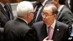 U.N. Secretary-General Ban Ki-moon, right, talks with Vitaly Churkin, Russia's U.N. ambassador, before a Security Council meeting at U.N. headquarters, Sept. 30, 2015. 