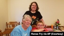 Renee Fry (back) is pictured with her mother Pat Fry and son Liam Fry Hawker. Renee, who owns her own business, moved in with her parents during the pandemic. This way, Grandmother Pat, a retired science teacher, could oversee Liam's online schooling. (Renee Fry via AP)