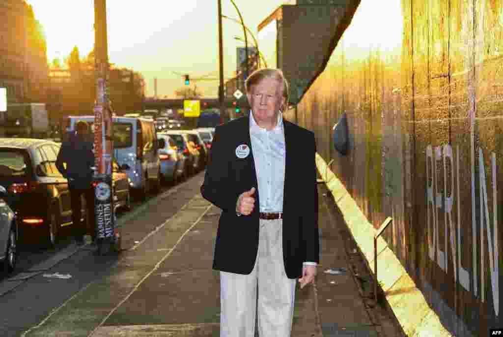 Madame Tussauds museum&#39;s wax figure of U.S. President is displayed along the East Side Gallery section of the Wall in Berlin, Germany.