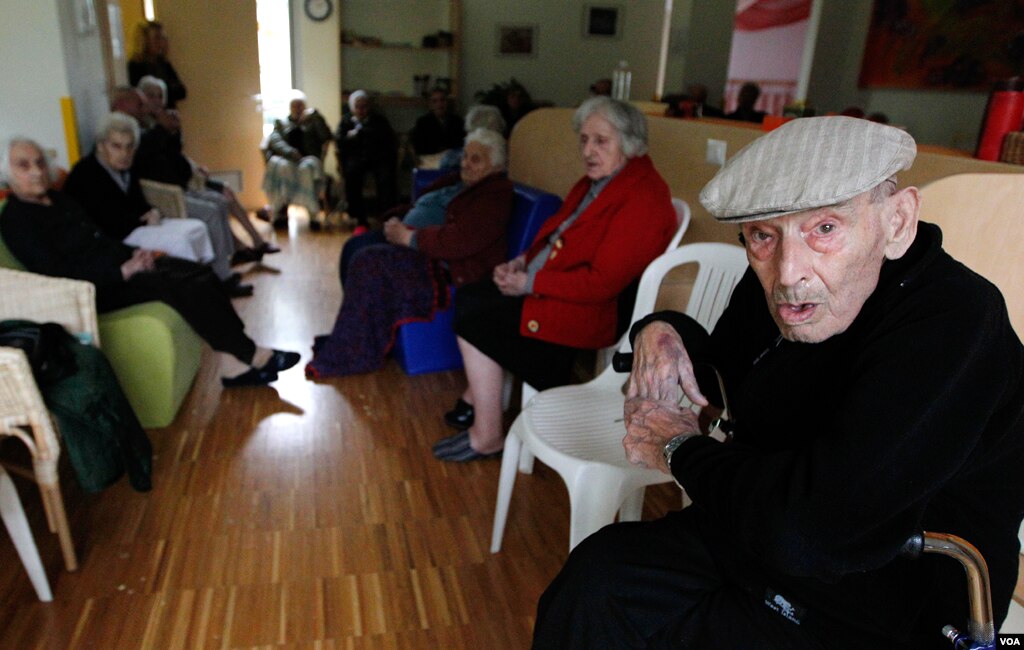 Elderly men and women evacuated from their homes, sit in a classroom of a kindergarten in Mirabello, Italy, May 20. 2012. (AP Photo/Luca Bruno)