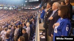Vice President Mike Pence, second lady Karen Pence, and Major General Courtney P. Carr stand for the singing of the national anthem at Lucas Oil Stadium before the start of the Indianapolis Colts game against the Francisco 49ers, prior to leaving the game, Oct. 8, 2017. (Official White House photo by Myles Cullen) 