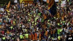 Thousands of Catalan separatists rally in public squares in Barcelona and other towns, Sept. 24, 2017, in support of a disputed referendum on independence of the northeastern region from Spain.. 