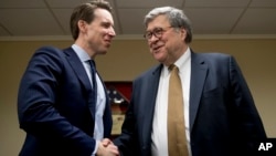 Attorney General nominee Bill Barr, right, meets with Sen. Josh Hawley, R-Miss., a member of the Senate Judiciary Committee, in Hawley's office, Jan. 29, 2019, in Washington.