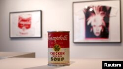 Andy Warhol's "Campbell's Chicken with Rice Soup," tin soup can filled with concrete, has a pre-auction estimate of $50,000-$70,000, on display at Christie's, New York City, Feb. 22, 2013.