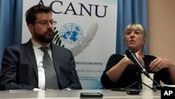 Peter Asaro, left, of the International Committee for Robot Arms Control, and Jody Williams of the Nobel Women's Initiative speak to reporters at a news conference in Geneva, Switzerland, Aug. 27, 2018. 