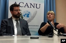 Peter Asaro, left, of the International Committee for Robot Arms Control, and Jody Williams of the Nobel Women's Initiative speak to reporters at a news conference in Geneva, Switzerland, Aug. 27, 2018.