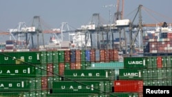 FILE - Cargo containers are seen sitting idle at the Port of Los Angeles, California, February 18, 2015.