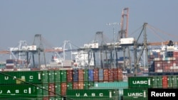FILE - Cargo containers sit at the Port of Los Angeles, California, Feb. 18, 2015. The Trump administration is promising “new and better trade deals with countries in key markets around the world.”