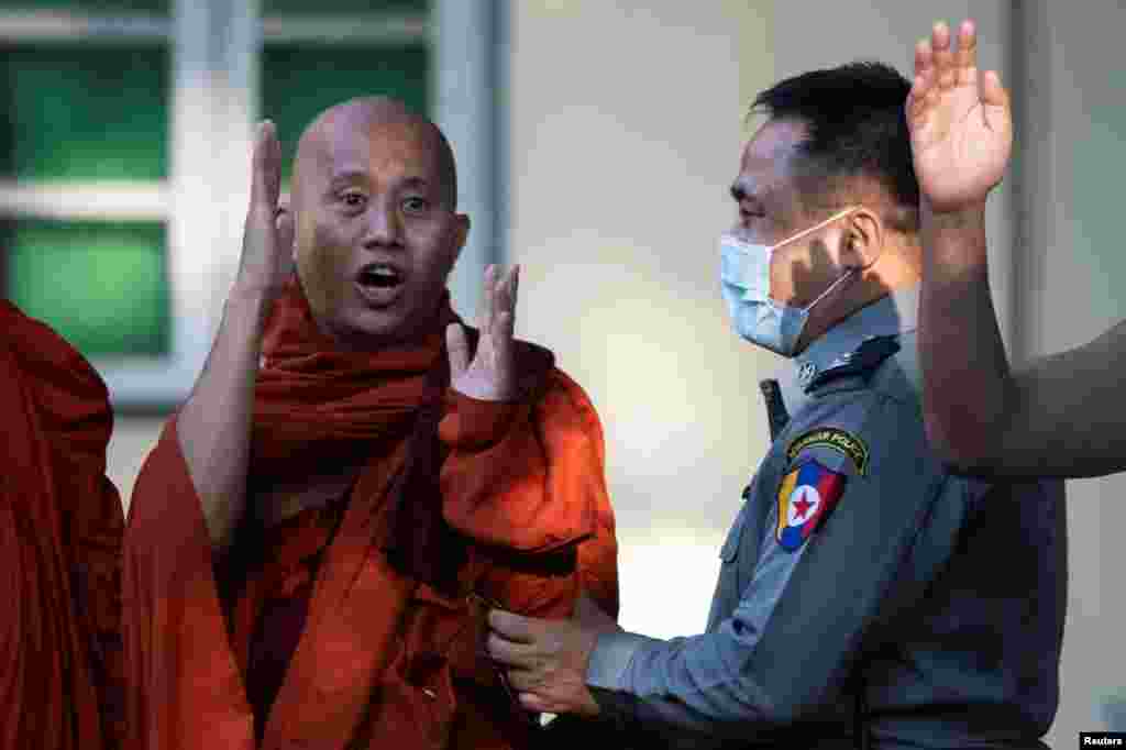 Fugitive Buddhist nationalist monk Wirathu hands himself in at a police station in Yangon, Myanmar.