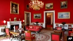 This Sept. 17, 2019, photo shows refreshed wall fabric in the Red Room of the White House in Washington. Sunlight streaming into the Red Room had left wall fabric "so faded it was almost pink." (AP Photo/Patrick Semansky)