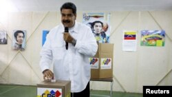 Venezuela's President Nicolas Maduro takes part in a voting drill, ahead of May 20 presidential election, in Caracas, Venezuela, May 6, 2018.