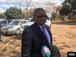 FILE - Harrison Nkomo from Zimbabwe Lawyers for Human Rights, who is representing Pastor Evan Mawarire, speaks to reporters in Harare, Zimbabwe, June 28, 2017. (S. Mhofu/VOA)