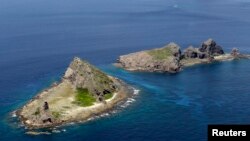 A group of disputed islands, known as Senkaku in Japan and Diaoyu in China is seen in the East China Sea (Reuters/Kyodo file photo)