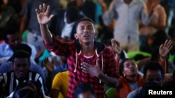 A man attends a prayer session at Biftu Bole Lutheran Church during a prayer and candle ceremony for protesters who died in the town of Bishoftu two weeks ago during Irreecha, the thanksgiving festival of the Oromo people, in Addis Ababa, Ethiopia, Oct. 1