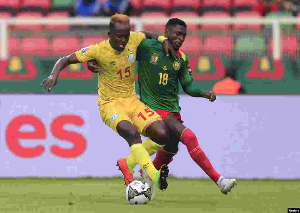 Cameroon&#39;s Martin Hongla in action with Ethiopia&#39;s Aschalew Tamene.