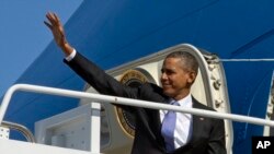 President Barack Obama boards Air Force One at Andrews Air Force Base, Maryland, Feb. 14, 2014, en route to Fresno, California, to discuss the ongoing drought. 