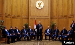 Adly Mansour (C), Egypt's chief justice and head of the Supreme Constitutional Court, speaks at his swearing in ceremony as the nation's interim president in Cairo, July 4, 2013.
