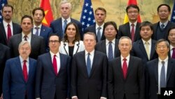 (L) U.S. Ambassador to China Terry Branstad, U.S. Treasury Secretary Steven Mnuchin, U.S. Trade Representative Robert Lighthizer, Chinese Vice PM Liu He, and People's Bank of China Governor Yi Gang pose for a group photo at the Diaoyutai State Guesthouse in Beijing, Feb. 15, 2019