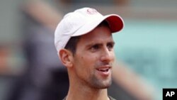 Novak Djokovic of Serbia attends a training session two days before the French Open tennis tournament at the Roland Garros stadium in Paris, May 20, 2011
