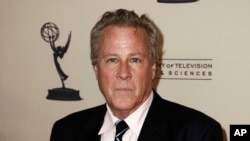 FILE - Actor John Heard arrives at a celebration for the 63rd Primetime Emmy Awards in Los Angeles, Sept. 12, 2011. Heard, best known for playing the father in the “Home Alone” movie series, has died. He was 71.
