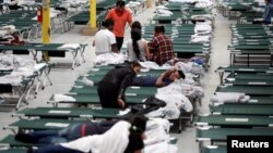 Migrants from Central America rest inside the "House of the Refugee," which gives temporary shelter to migrants released by ICE and CBP due to overcrowded facilities, in El Paso, Texas, April 24, 2019. 