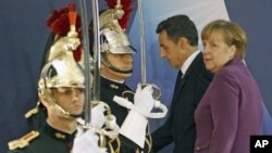 Αυστηρή η στάση Μέρκελ και Σαρκοζί στις Κάννες