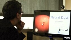 A scientist as the University of California, Berkeley works on the technology called 'neural dust.'