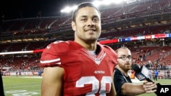 FILE - San Francisco 49ers running back Jarryd Hayne (38) walks off the field after an NFL preseason football game against the San Diego Chargers in Santa Clara, Calif., Sept. 3, 2015. 
