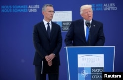 U.S. President Donald Trump speaks beside NATO Secretary-General Jens Stoltenberg at the start of the NATO summit at their new headquarters in Brussels, Belgium, May 25, 2017.