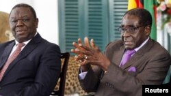 Tổng thống Zimbabué Robert Mugabe (phải) và Thủ tướng Morgan Tsvangirai 
