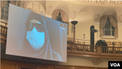An Iranian woman disguised to conceal her identify gives live video testimony from Iran on Nov. 10, 2021, to a London-based international people's tribunal investigating alleged atrocities in Iran's deadly crackdown on nationwide protests in Nov. 2019. (VOA Persian/Ramin Haghjoo)