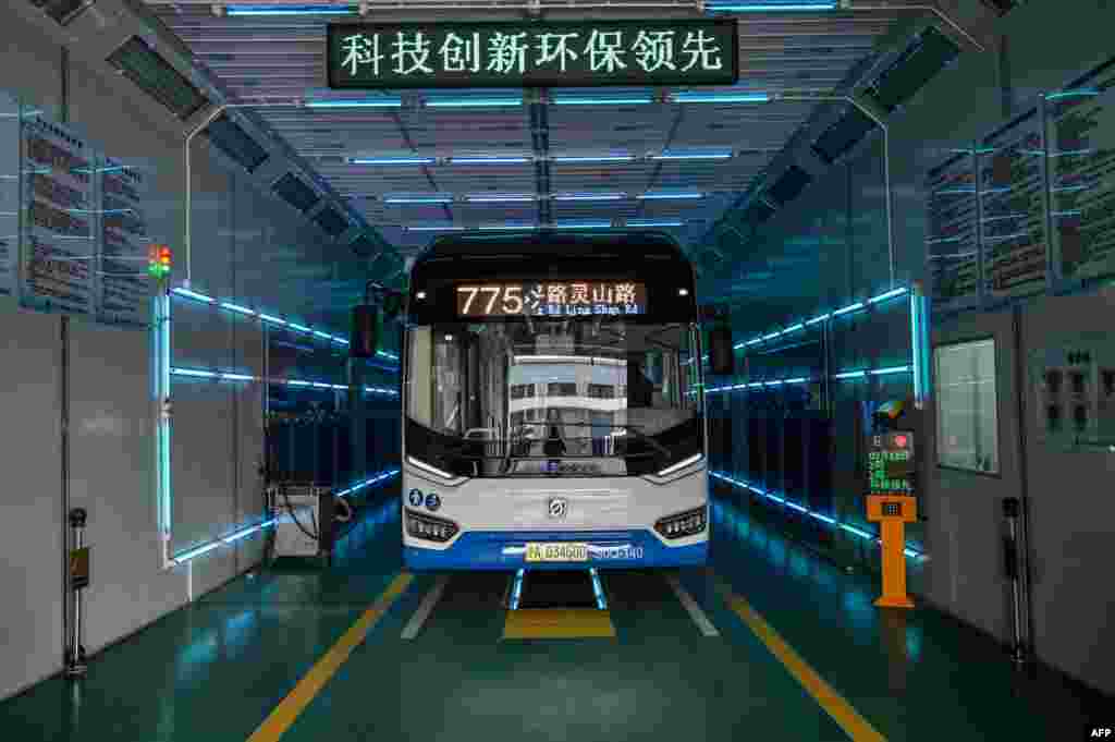 A bus is cleaned with ultraviolet rays as part of measures against of the COVID-19 coronavirus in Shanghai, China.