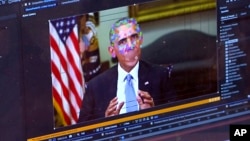 This image made from video of a fake video featuring former President Barack Obama shows elements of facial mapping used in new technology that lets anyone make videos of real people appearing to say things they've never said.