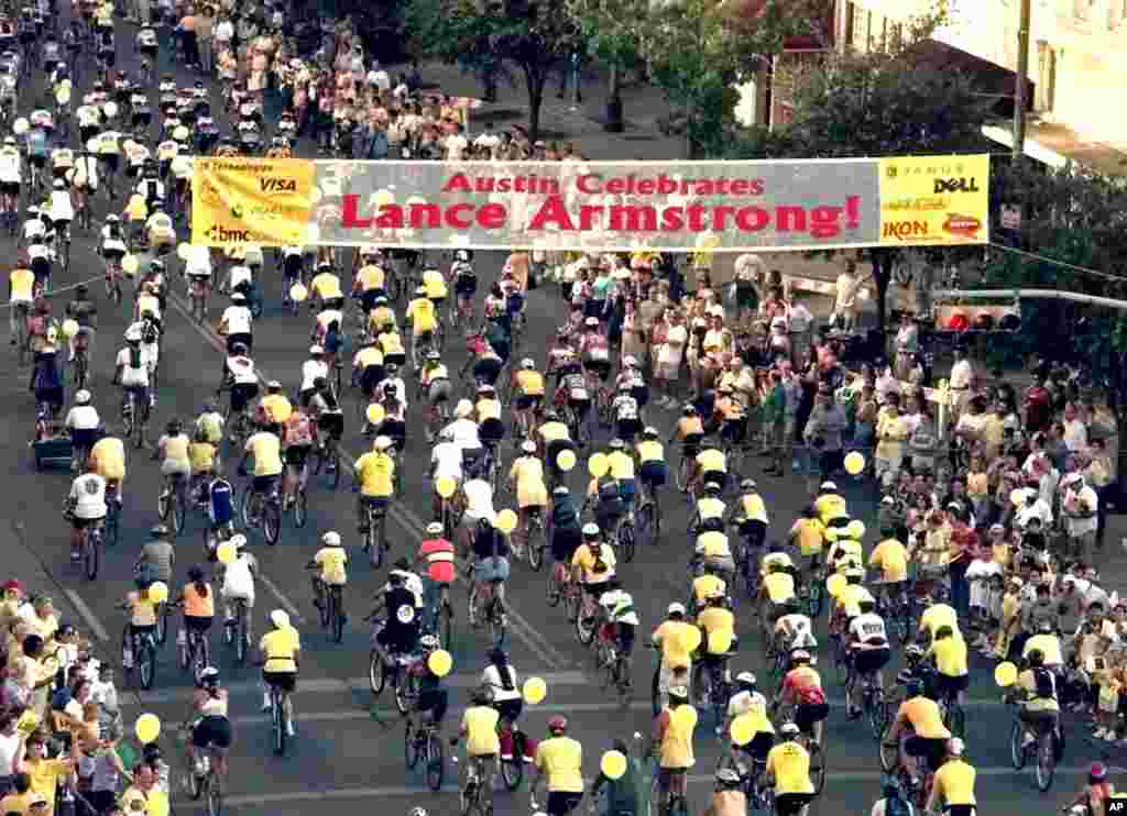 August 1999: Bicyclists roll down Congress Ave. in Austin, Texas, where Armstrong currently lives, during a parade held in his honor.