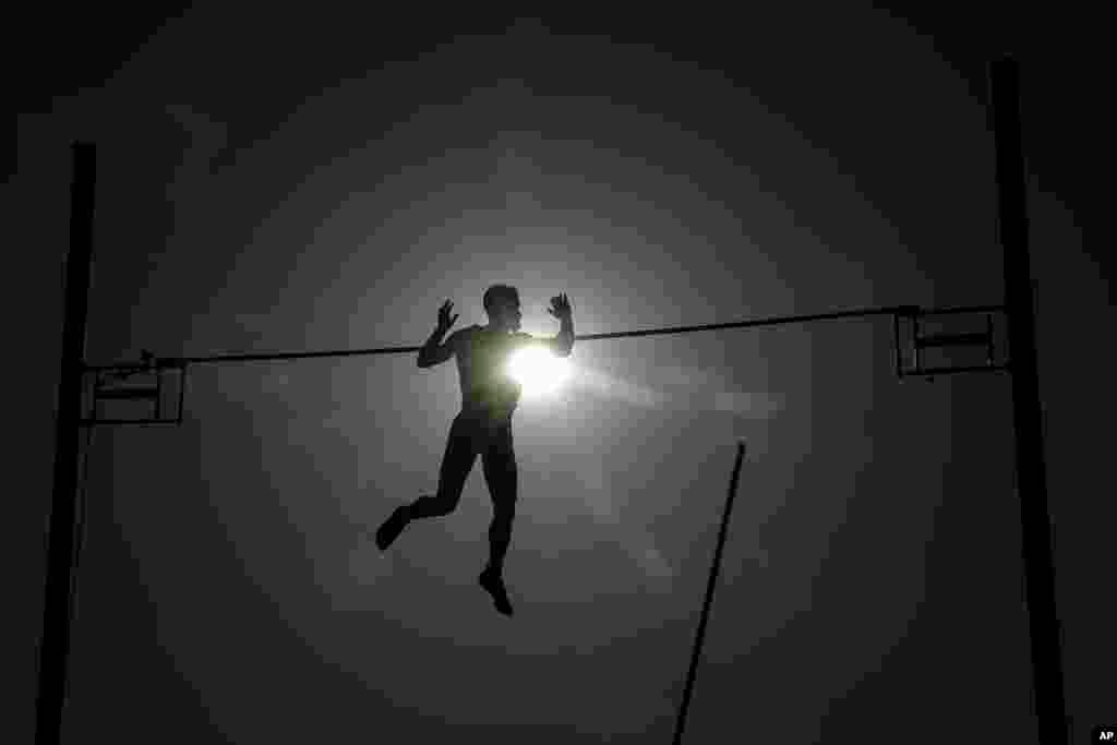 Athlete Dimitris Patsourakis from Greece competes at the Athens Street Pole Vault competition in front of Zappeion Hall, June 25, 2019.