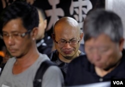 A protester cries as he mourns jailed Chinese Nobel Peace laureate Liu Xiaobo during a demonstration outside the Chinese liaison office in Hong Kong, Thursday, July 13, 2017. Officials say China's most prominent political prisoner, Nobel Peace Prize laureate Liu Xiaobo, has died. He was 61. (AP Photo/Vincent Yu)
