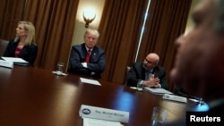 U.S. President Donald Trump meets with members of Congress and U.S. law enforcement, discussing crime and immigration issues, specifically the MS-13 gang, at the White House in Washington, Feb. 6, 2018. 