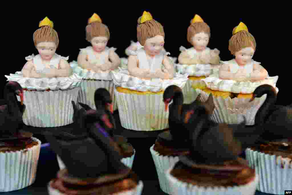 A cupcake interpretation of Swan lake is displayed during the final day of the Cake International show in Manchester, north west England.