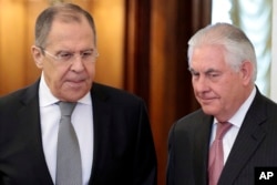 U.S. Secretary of State Rex Tillerson, right, and Russian Foreign Minister Sergey Lavrov, enter a hall prior to their talks in Moscow, Russia, April 12, 2017.