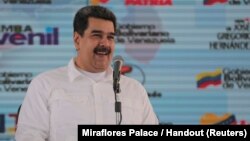 Venezuela's President Nicolas Maduro attends an event with supporters in Caracas, Venezuela, Nov. 13, 2018.