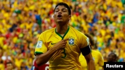 Brazil's Thiago Silva celebrates after scoring against Colombia during their 2014 World Cup quarterfinals at the Castelao arena in Fortaleza, July 4, 2014. 