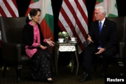 Myanmar's State Counselor Aung San Suu Kyi and U.S. Vice President Mike Pence hold a bilateral meeting in Singapore, Nov. 14, 2018.