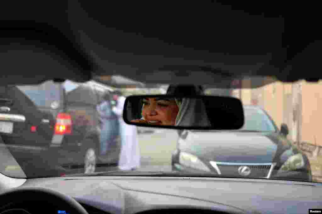 Dr Samira al-Ghamdi, 47, a practicing psychologist, drives around the side roads of a neighborhood as she prepares to hit the road on Sunday as a licensed driver, in Jeddah, Saudi Arabia June 21, 2018.